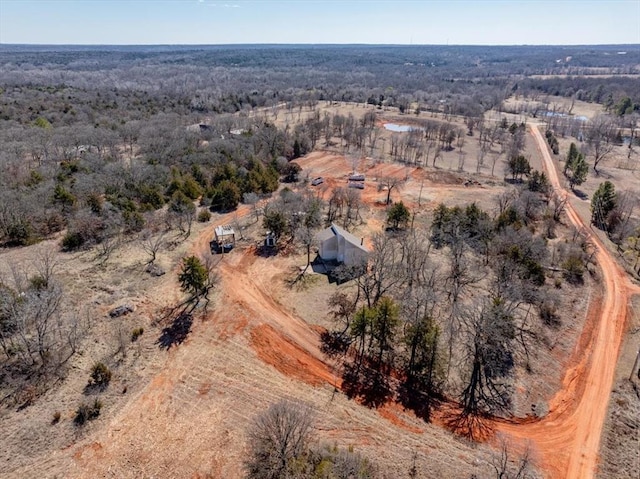 birds eye view of property featuring a rural view and a forest view