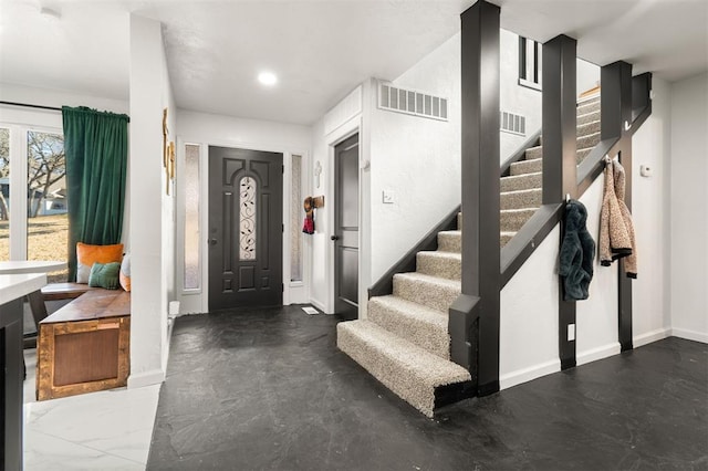 entryway featuring stairway, baseboards, visible vents, and recessed lighting