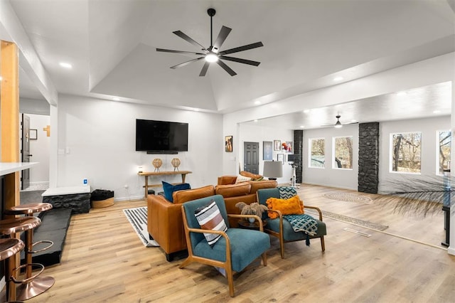 living room featuring light wood-type flooring, ceiling fan, and recessed lighting