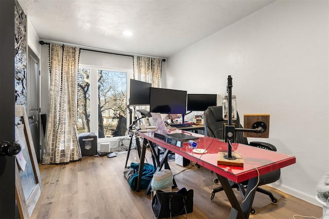 office area featuring wood finished floors and baseboards