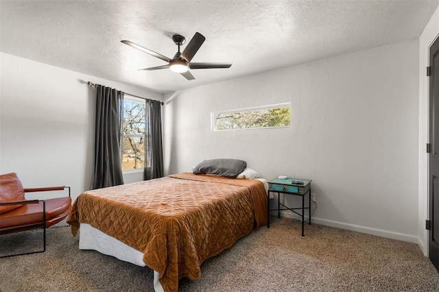 bedroom with carpet flooring, ceiling fan, a textured ceiling, and baseboards