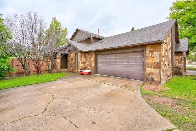 view of front of property with a garage, stone siding, concrete driveway, and roof with shingles