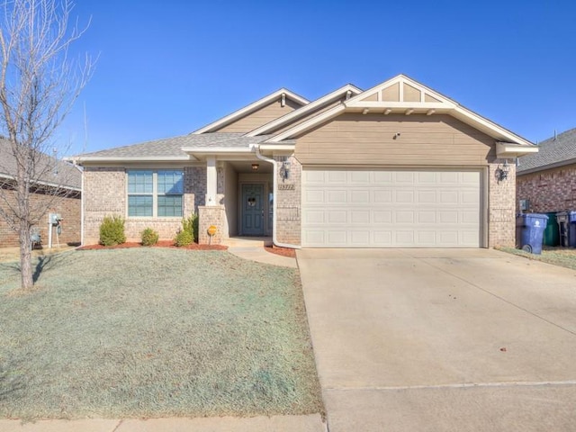 craftsman-style house with a garage, concrete driveway, and brick siding