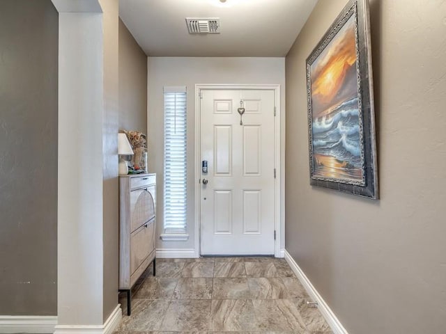 entrance foyer with visible vents and baseboards