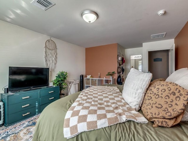 bedroom featuring visible vents