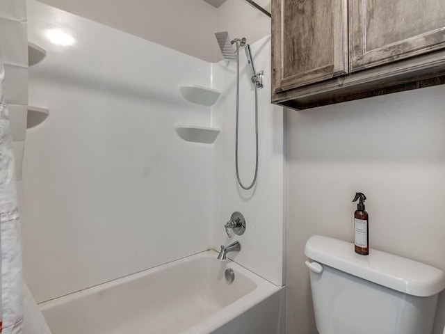 full bath featuring shower / bath combo with shower curtain and toilet