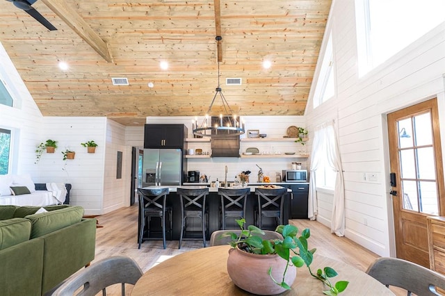 kitchen with appliances with stainless steel finishes, wood ceiling, light wood-style flooring, and open shelves