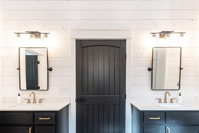 bathroom with two vanities and a sink