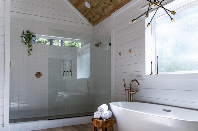 bathroom with a stall shower, a soaking tub, wooden ceiling, and vaulted ceiling