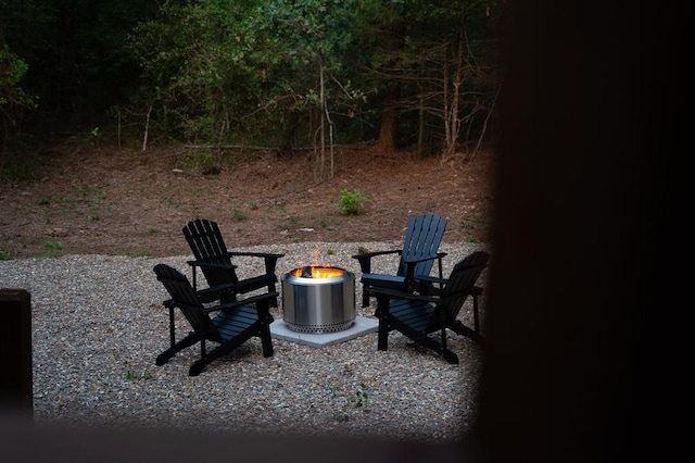 view of patio / terrace featuring an outdoor fire pit