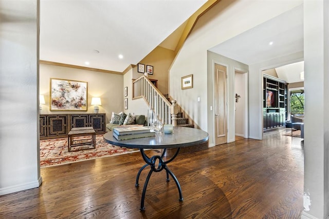 interior space featuring stairway, baseboards, and wood finished floors