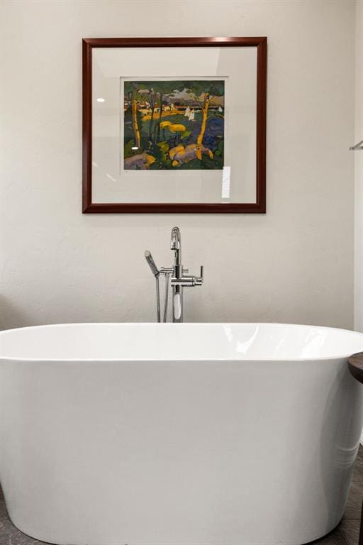 full bath featuring a freestanding bath