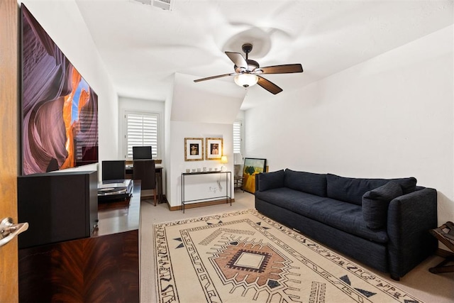 living room featuring a ceiling fan