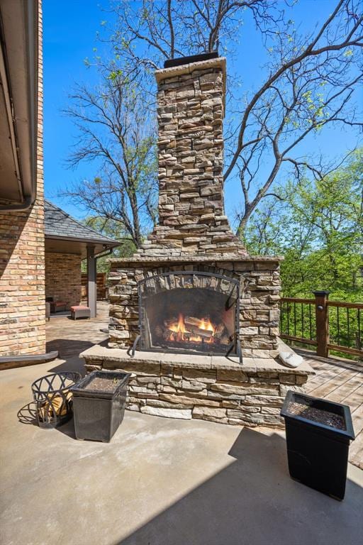 view of patio / terrace with an outdoor stone fireplace