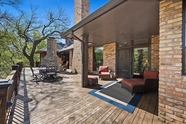 wooden deck with outdoor dining area