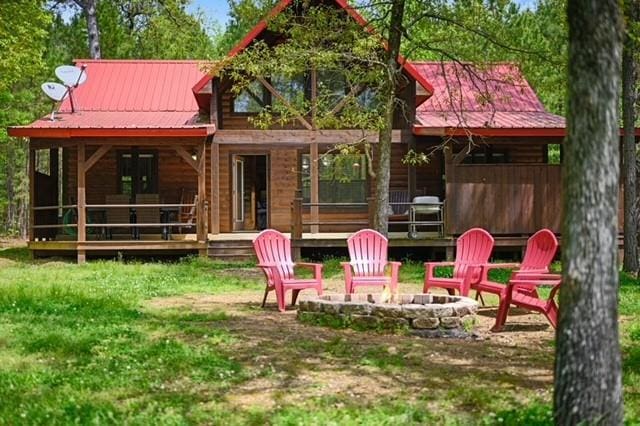 exterior space featuring a fire pit and a porch