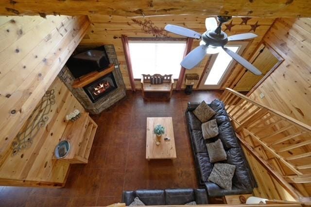 unfurnished living room with ceiling fan