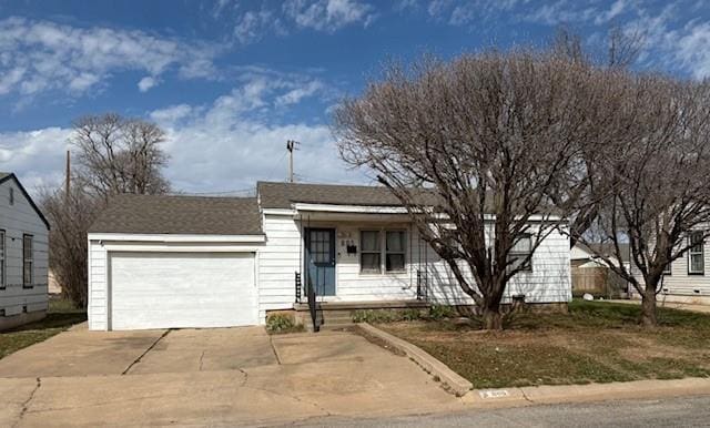 ranch-style home featuring concrete driveway and a garage