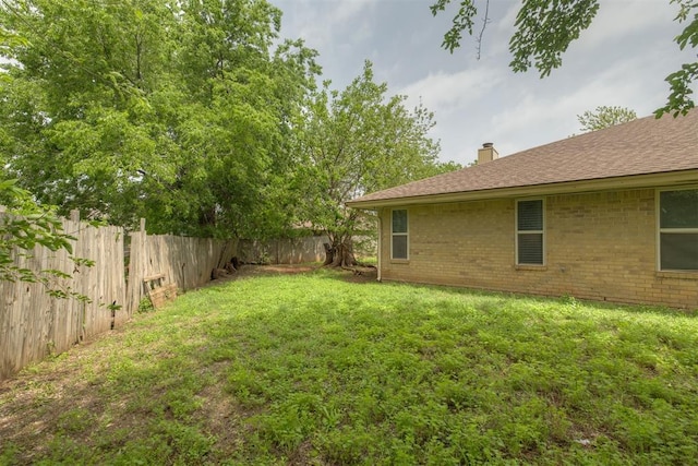 view of yard featuring a fenced backyard