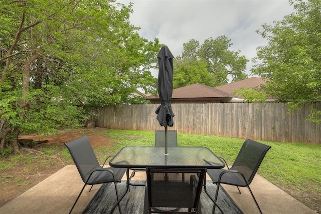 view of patio / terrace with outdoor dining area and a fenced backyard