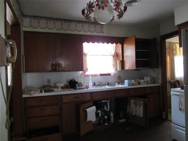 111 W Hillcrest Ln, Hobart, OK 73651 - kitchen with a sink, visible vents, open shelves, light countertops, and electric stove