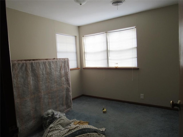 111 W Hillcrest Ln, Hobart, OK 73651 - empty room with carpet, visible vents, and baseboards