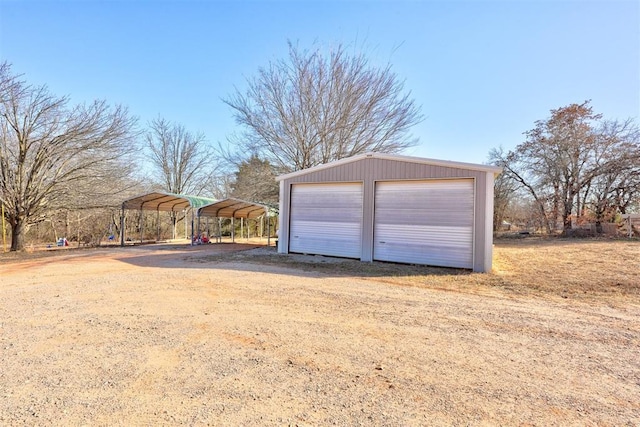 detached garage with a carport