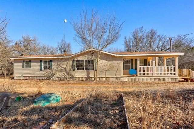 ranch-style house with covered porch