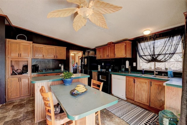 kitchen featuring a sink, a kitchen island, a ceiling fan, vaulted ceiling, and black appliances