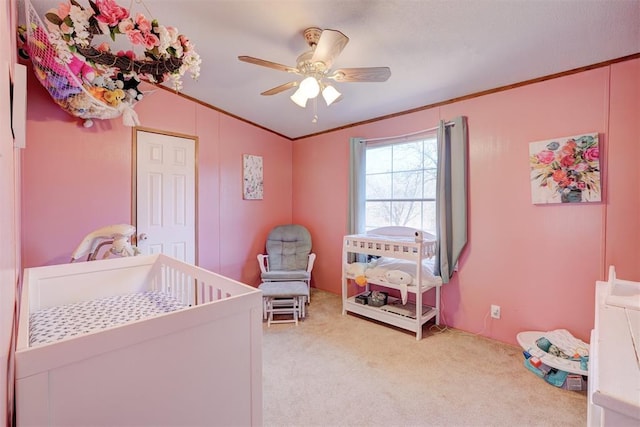 bedroom featuring a ceiling fan, carpet, and crown molding