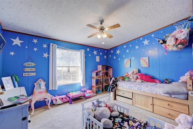 carpeted bedroom featuring ornamental molding and a ceiling fan