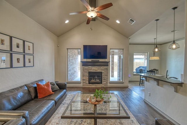 living area with a fireplace, recessed lighting, visible vents, dark wood-type flooring, and a ceiling fan