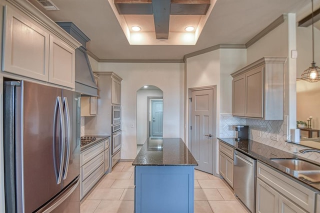 kitchen with arched walkways, stainless steel appliances, a sink, visible vents, and dark stone counters