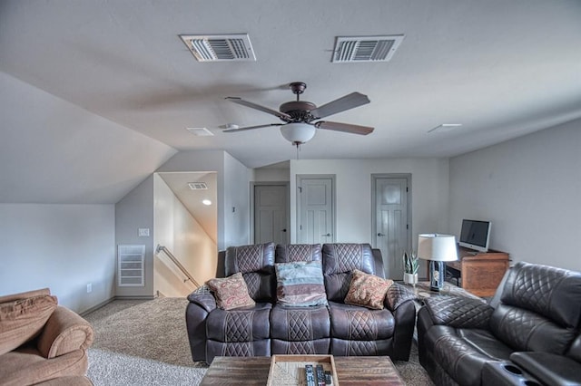 carpeted living room featuring visible vents, vaulted ceiling, and a ceiling fan