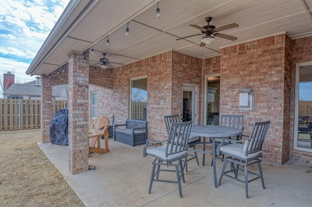 view of patio / terrace featuring outdoor dining space, a grill, fence, and ceiling fan