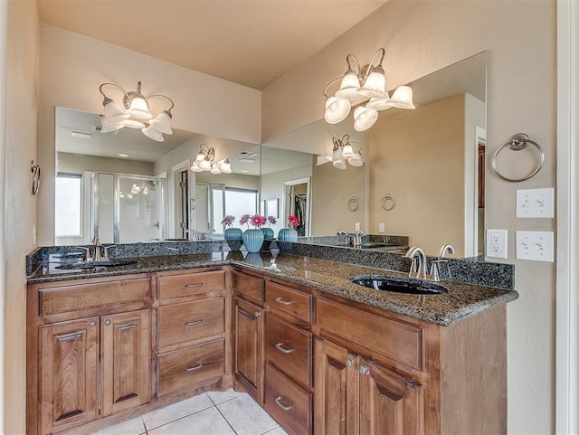 bathroom with plenty of natural light, a sink, and tile patterned floors