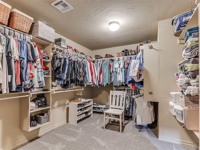 spacious closet with visible vents and carpet flooring