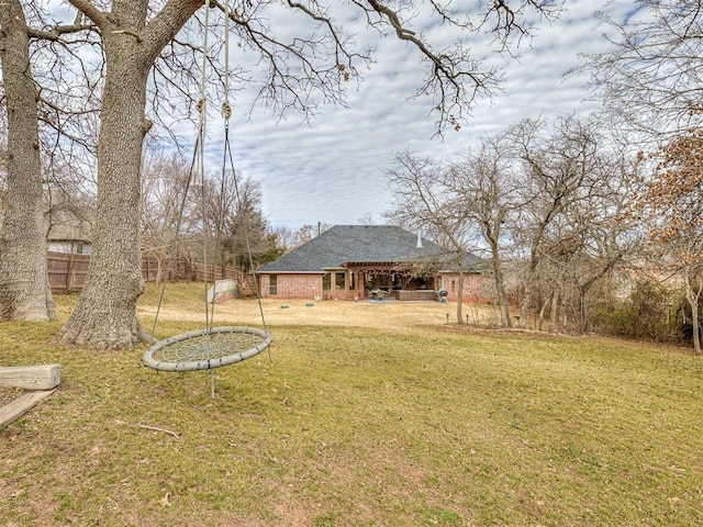 view of yard with fence and a patio