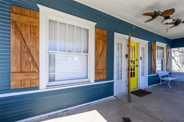 doorway to property with a ceiling fan and a porch