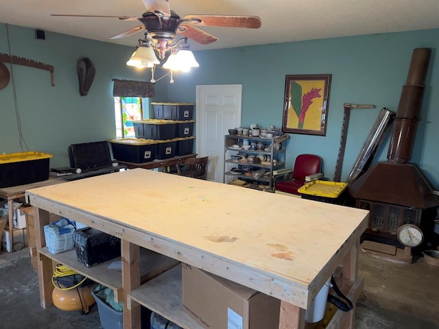 interior space with concrete flooring and a ceiling fan