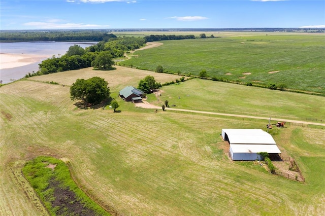 drone / aerial view with a water view and a rural view