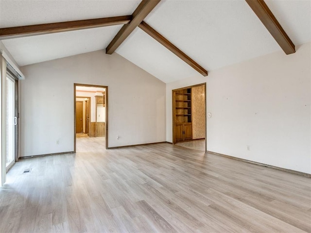 unfurnished living room with baseboards, visible vents, vaulted ceiling with beams, and light wood finished floors