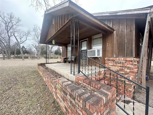 exterior space featuring a porch and cooling unit