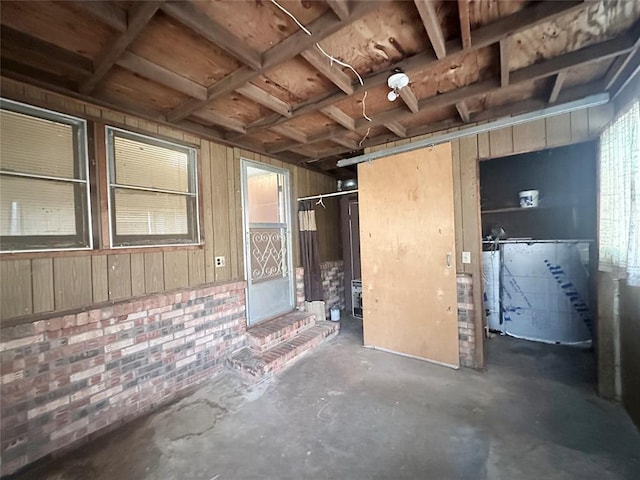 interior space with unfinished concrete flooring