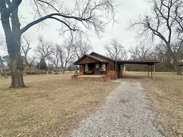 view of front of home featuring driveway, board and batten siding, a porch, and a carport