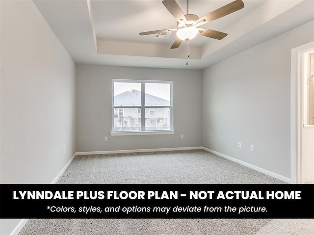 8516 NW 75th St, Oklahoma City, OK 73132 - spare room with carpet floors, baseboards, visible vents, a ceiling fan, and a tray ceiling