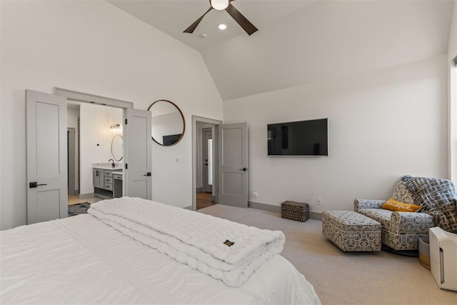 carpeted bedroom with ceiling fan, high vaulted ceiling, recessed lighting, baseboards, and ensuite bath