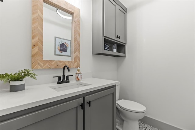 half bath with vanity and toilet