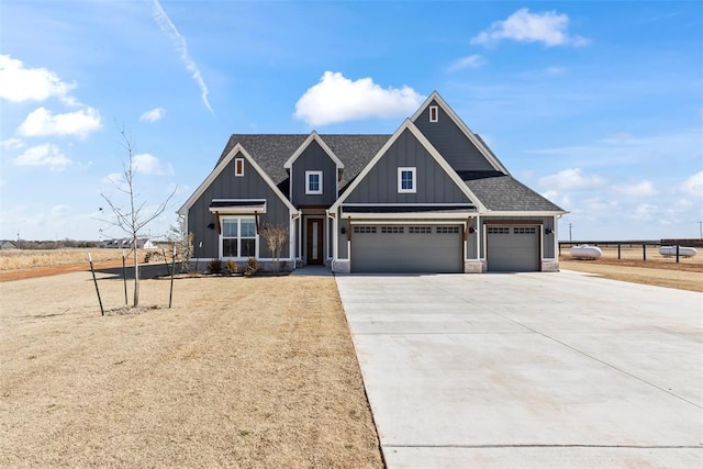 craftsman inspired home featuring a garage, a shingled roof, concrete driveway, fence, and board and batten siding