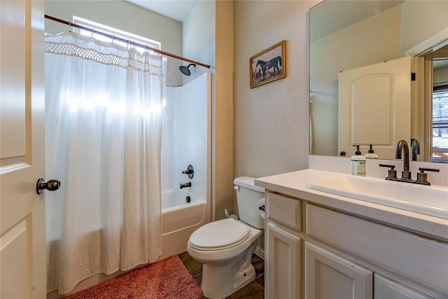 bathroom with vanity, shower / bath combination with curtain, and toilet